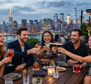 Friends dining with skyline background